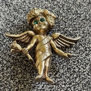 Gold Toned  Winged Cherub Pin Green Rhinestone Eyes.